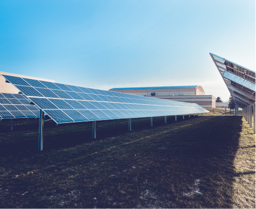 Close up of solar panels with a blue sky in the background.