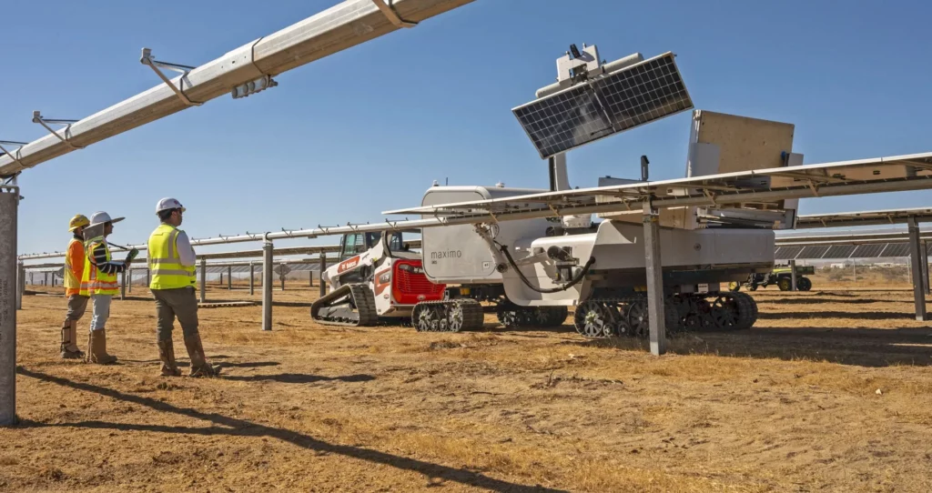 Steel posts and racking and automated machine with solar panel.