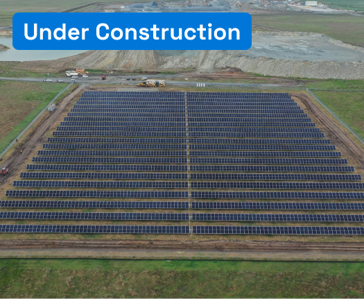 Aerial view of solar farm next to a quarry