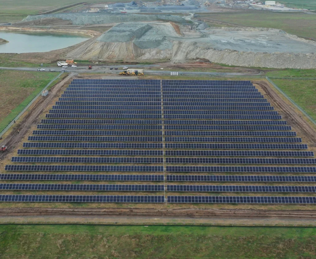 Aerial view of solar farm next to a quarry