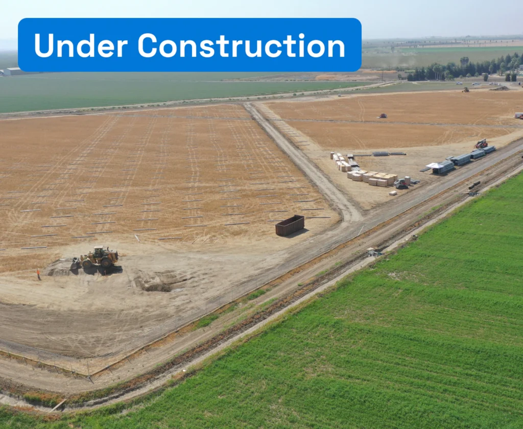 Wide aerial view of land preparation and post installation for a solar array at Banta-Carbona Irrigation District.