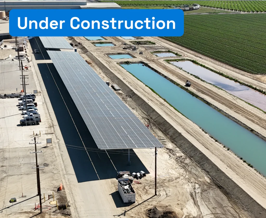 Aerial view of a solar canopy structure at an industrial agricultural facility.