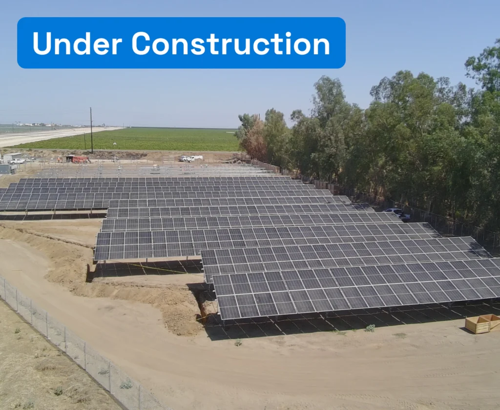High-angle view of ground-mounted solar panel rows under construction at Kern Tulare Water District.